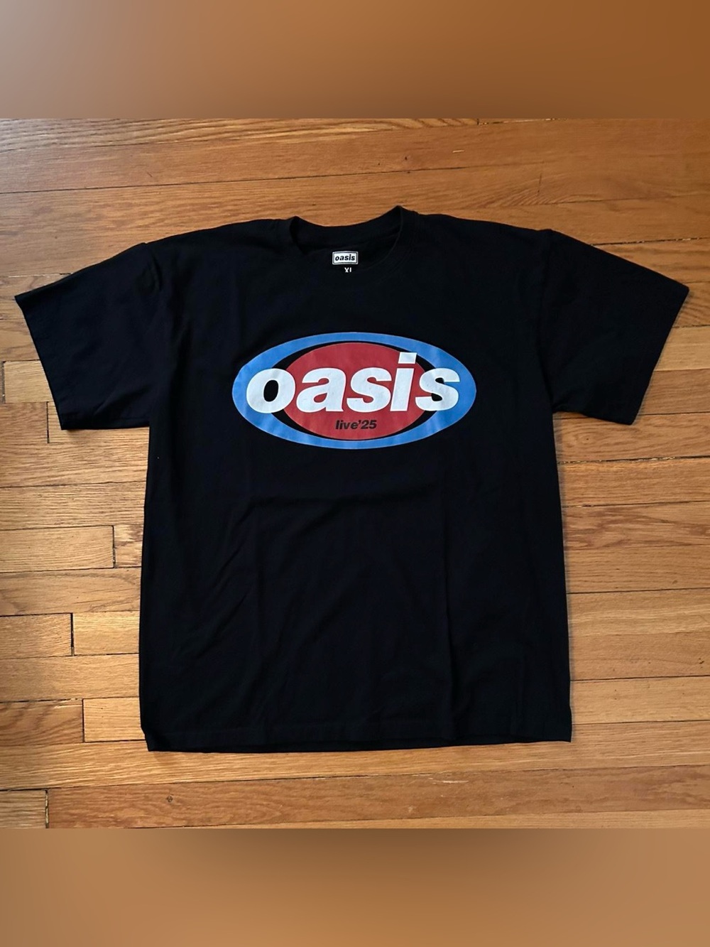 Oasis Black Tee with Red & Blue Oval Logo